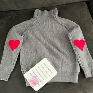 Heart patchwork turtleneck sweater